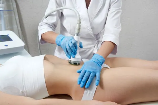 Lost the Weight but Not the Loose Skin? 2 woman having HIFU treatment on her stomach to combat loose skin West Thurrock following weight loss